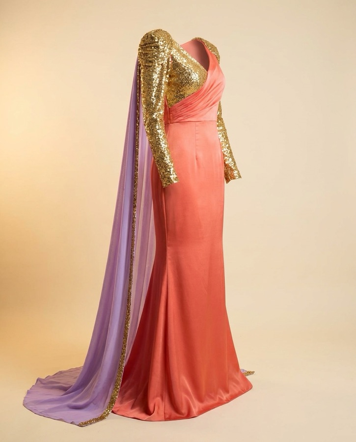 Caliente by Oscar B — coral one-shoulder gown with gold sleeve